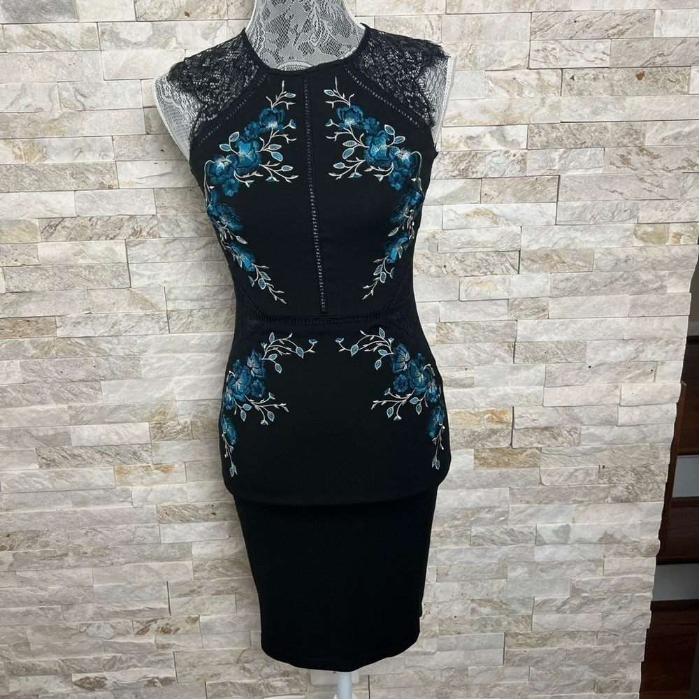 Black bodycon dress with turqoise embroidery